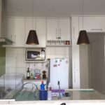 Visão de frente da cozinha do loft